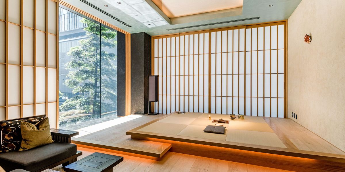 A bright room with paper screens, a low wooden platform and soft daylight