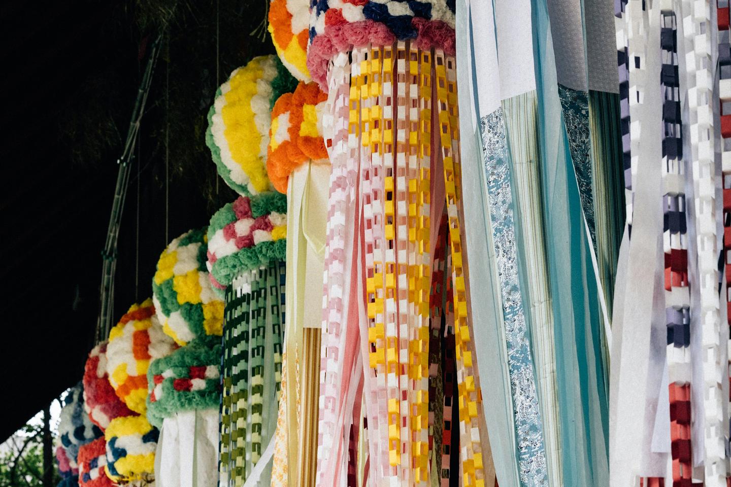 Long paper streamers and ornaments hanging in a street for a summer Tanabata festival