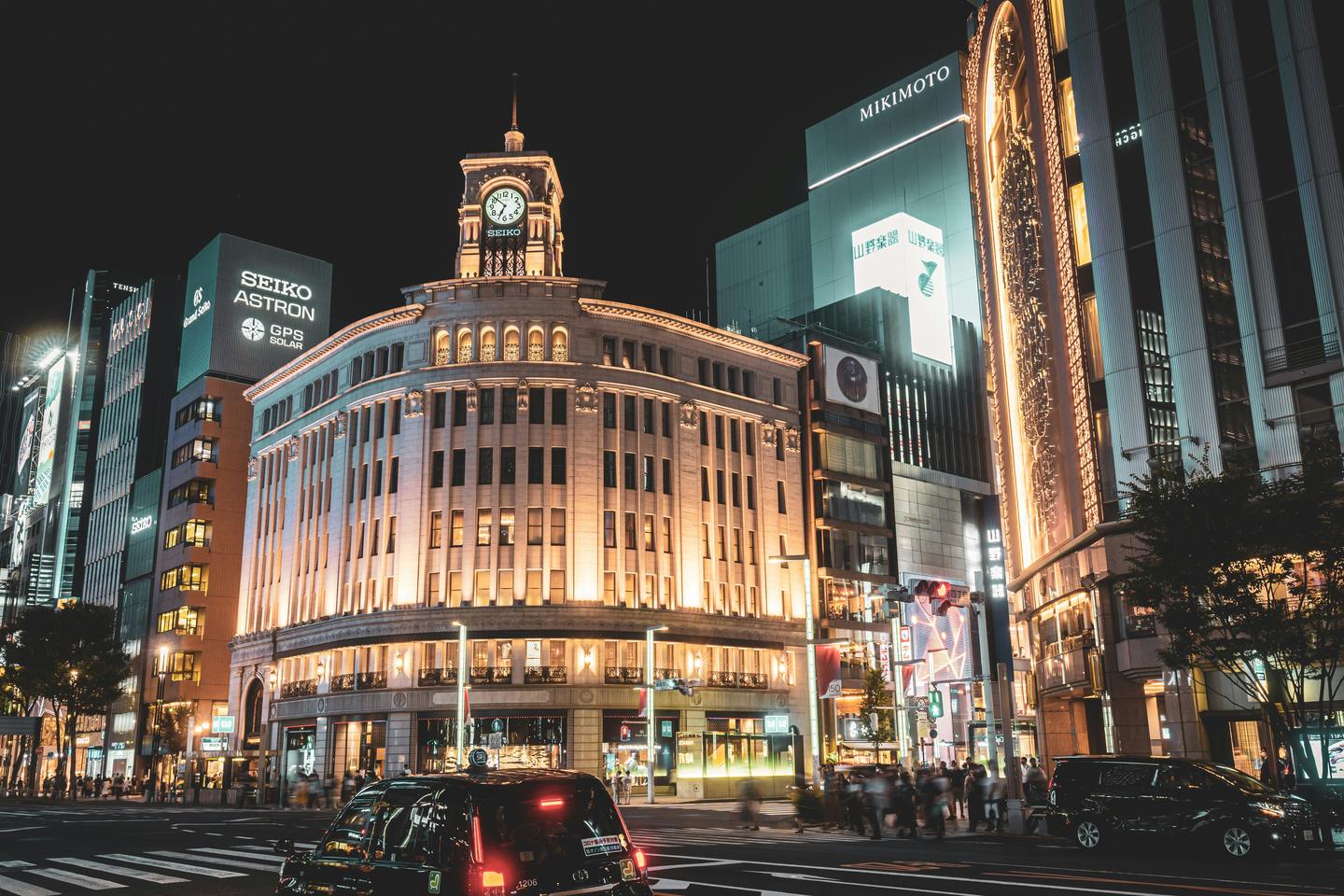 The clock tower on the Ginza 4-chome crossing lit up at night